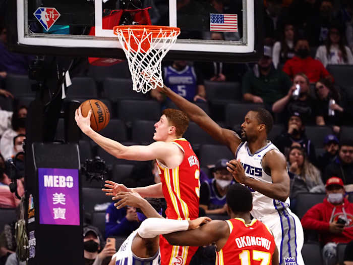 Jan 5, 2022; Sacramento, California, USA; Atlanta Hawks guard Kevin Huerter (3) scores a basket against Sacramento Kings forward Harrison Barnes (40) during the fourth quarter at Golden 1 Center.