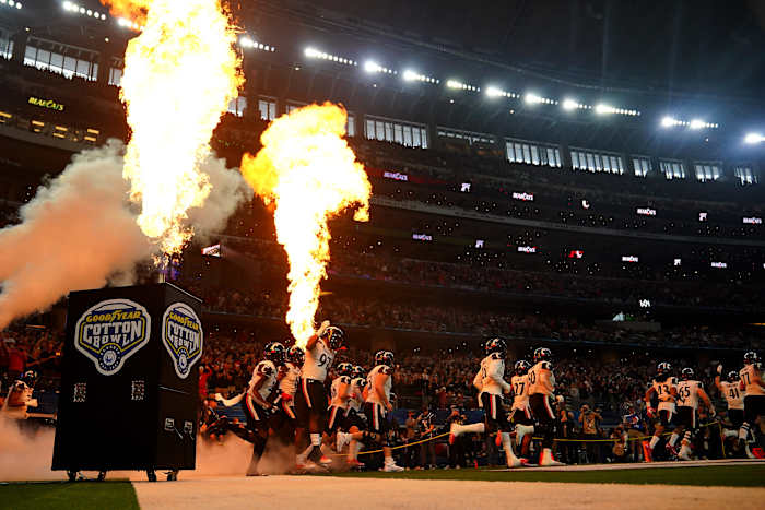 The Cincinnati Bearcats are introduced ahead of the College Football Playoff semifinal game against the Alabama Crimson Tide at the 86th Cotton Bowl Classic, Friday, Dec. 31, 2021, at AT&T Stadium in Arlington, Texas.