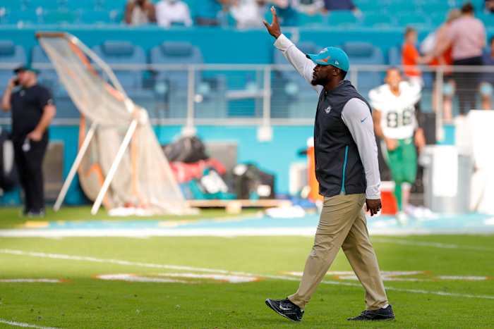 Miami Dolphins head coach Brian Flores waves at fans after winning the game against the New York Jets at Hard Rock Stadium.