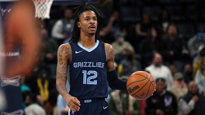 Memphis Grizzles guard Ja Morant (12) brings the ball up the court during the second half against the Minnesota Timberwolves.