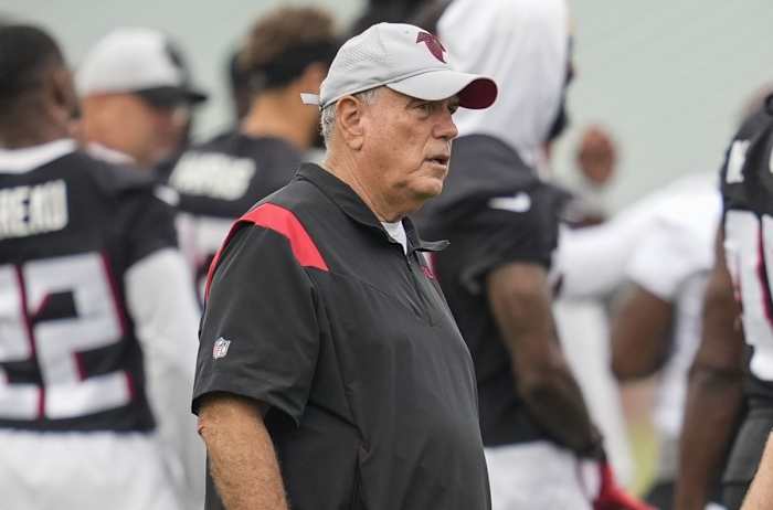 Atlanta Falcons defensive coordinator Dean Pees (left) talks to head coach Arthur Smith on the field during training camp at the Atlanta Falcons Training Facility.