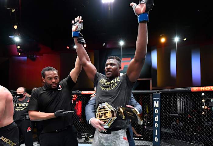 Francis Ngannou celebrates his victory over Stipe Miocic in UFC's heavyweight championship fight at UFC 260 on March 27, 2021.