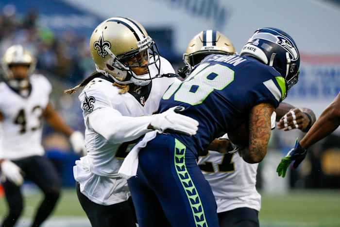 New Orleans Saints cornerback Bradley Roby (21) tackles Seattle receiver Freddie Swain (18). Mandatory Credit: Joe Nicholson-USA TODAY