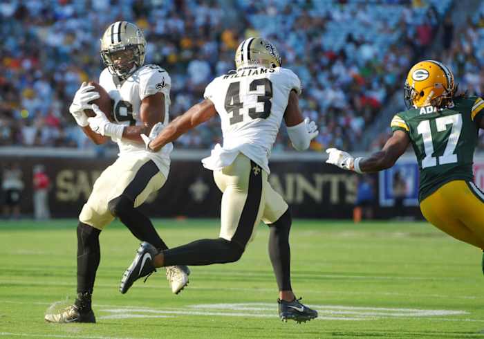 New Orleans Saints cornerback Paulson Adebo (29) intercepts a pass from Green Bay quarterback Aaron Rodgers (12). Bob Self/Florida Times-Union via Imagn Content Services, LLC