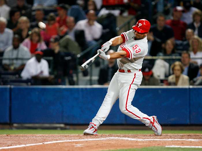 Phillies right fielder Bobby Abreu drives in
shortstop Jimmy Rollins against the Braves at Turner Field in Atlanta.