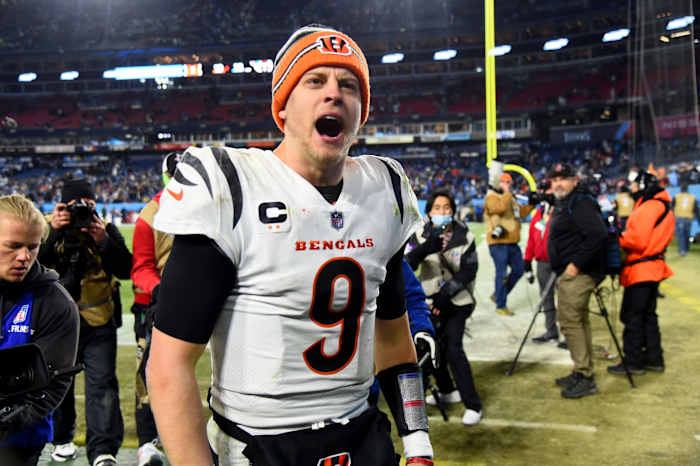 Jan 22, 2022; Nashville, Tennessee, USA; Cincinnati Bengals quarterback Joe Burrow (9) celebrates after the Bengals defeated the Tennessee Titans 19-16 in the AFC Divisional playoff football game at Nissan Stadium. Mandatory Credit: Christopher Hanewinckel-USA TODAY Sports