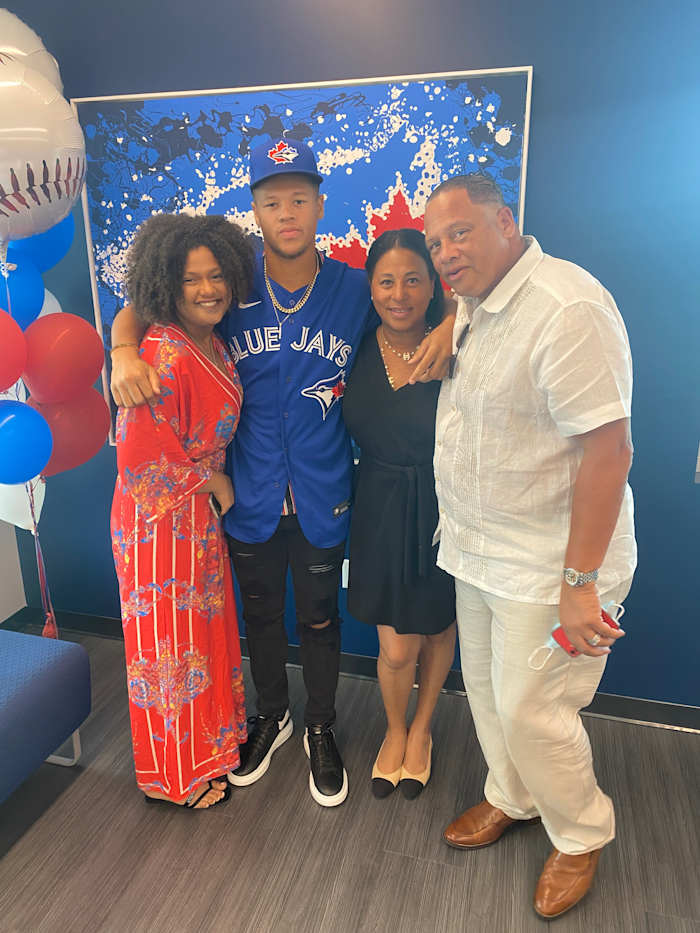 Carter with his "Big Three" family members—sister Gia (left), mom Stacey (middle) and dad Irv Sr. (right)—on signing day.