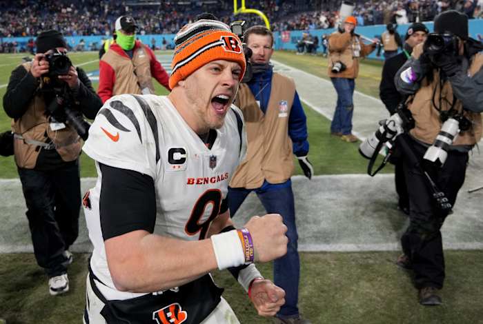 Jan 22, 2022; Nashville, Tennessee, USA; Cincinnati Bengals quarterback Joe Burrow (9) celebrates after defeating the Tennessee Titans 19-16 during the AFC Divisional playoff football game at Nissan Stadium. Mandatory Credit: Kirby Lee-USA TODAY Sports