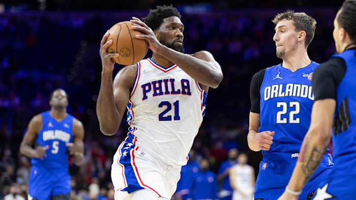 Philadelphia 76ers center Joel Embiid (21) drives against Orlando Magic forward Franz Wagner