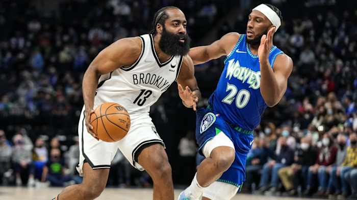 Brooklyn Nets guard James Harden (13) dribbles past Minnesota Timberwolves forward Josh Okogie (20) during the second quarter