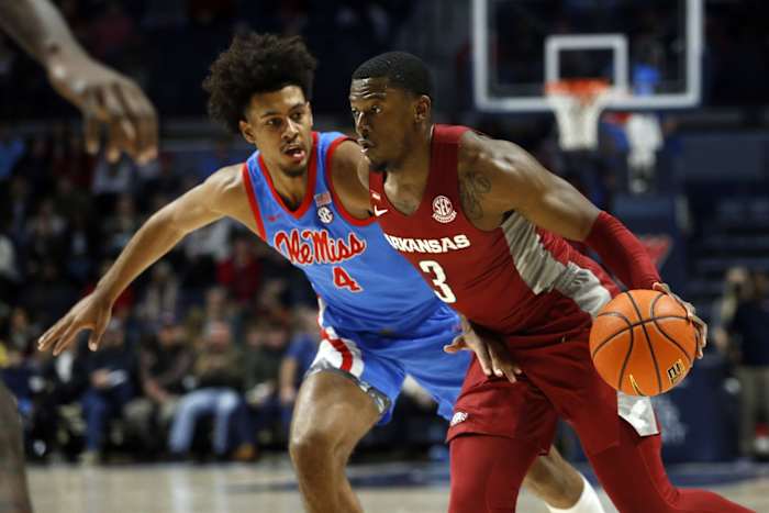 Arkansas Razorbacks forward Trey Wade (3) drives to the basket as Mississippi Rebels forward Jaemyn Brakefield (4) defends during the first half at The Sandy and John Black Pavilion at Ole Miss.
