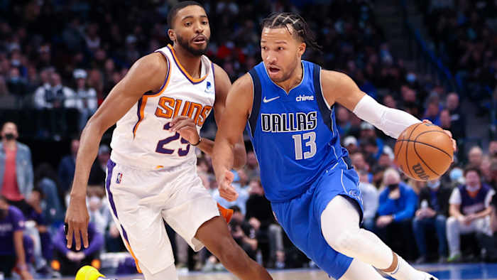 Dallas Mavericks guard Jalen Brunson (13) drives to the basket as Phoenix Suns forward Mikal Bridges.