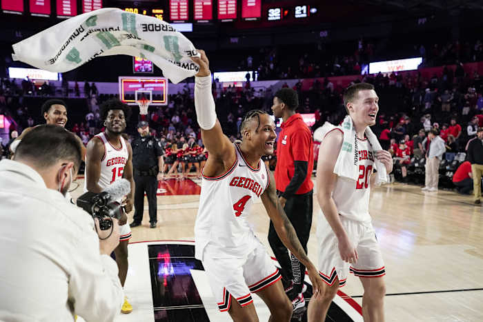 Georgia Bulldogs including forward Tyron McMillan (4) react after Georgia defeated the Alabama Crimson Tide at Stegeman Coliseum.