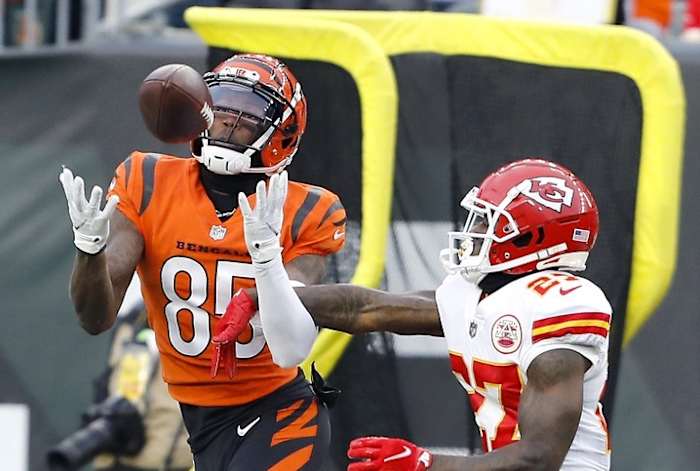 Jan 2, 2022; Cincinnati, Ohio, USA; Cincinnati Bengals wide receiver Tee Higgins (85) makes the catch over Kansas City Chiefs cornerback Rashad Fenton (27) during the fourth quarter at Paul Brown Stadium. Mandatory Credit: Joseph Maiorana-USA TODAY Sports