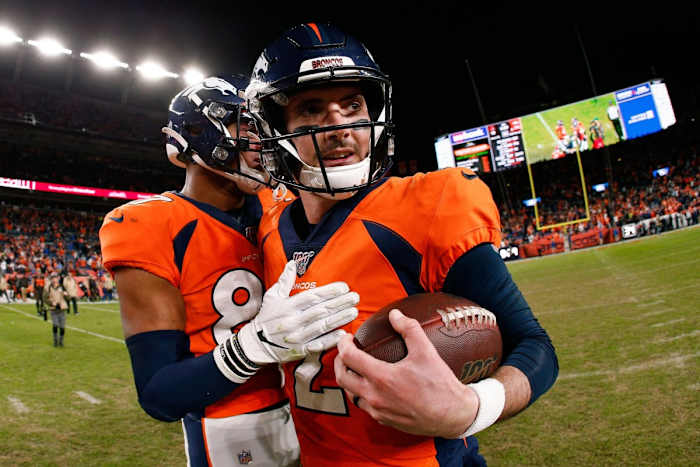 Denver Broncos tight end Noah Fant (87) celebrates with quarterback Brandon Allen (2) after the game against the Cleveland Browns at Empower Field at Mile High.