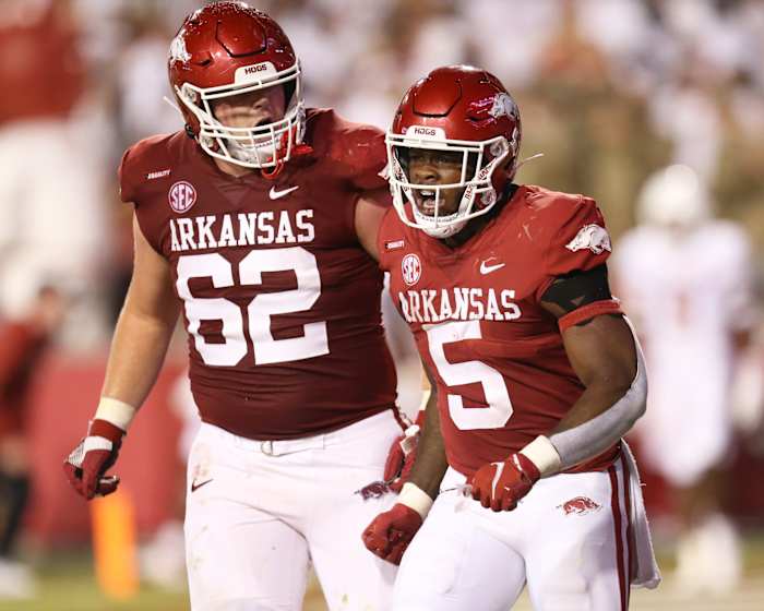 Arkansas Razorbacks offensive lineman Brady Latham (62) celebrates after a touchdown by running back Raheim Sanders (5) against the Texas Longhorns at Donald W. Reynolds Razorback Stadium. Arkansas won 40-21.