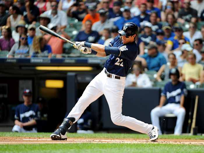 Jul 28, 2019; Milwaukee, WI, USA; Milwaukee Brewers right fielder Christian Yelich (22) hits the ball against the Chicago Cubs at Miller Park.