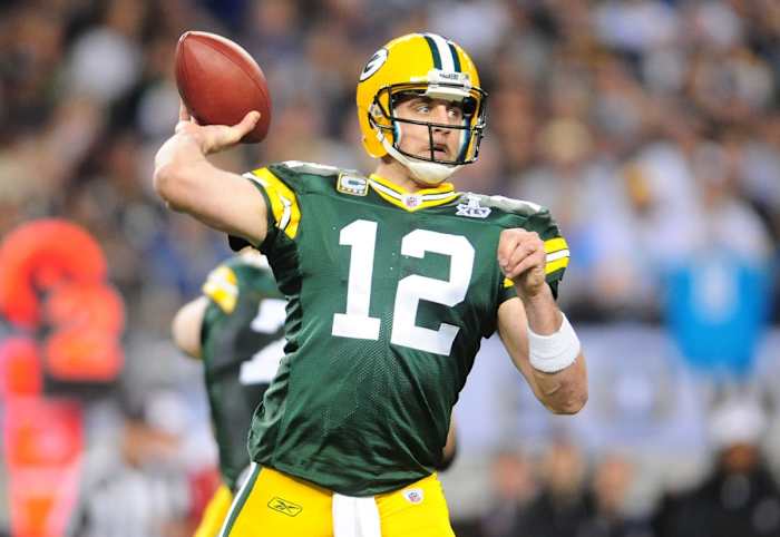 Green Bay Packers quarterback Aaron Rodgers (12) passes the ball against the Pittsburgh Steelers during the first half of Super Bowl XLV at Cowboys Stadium.