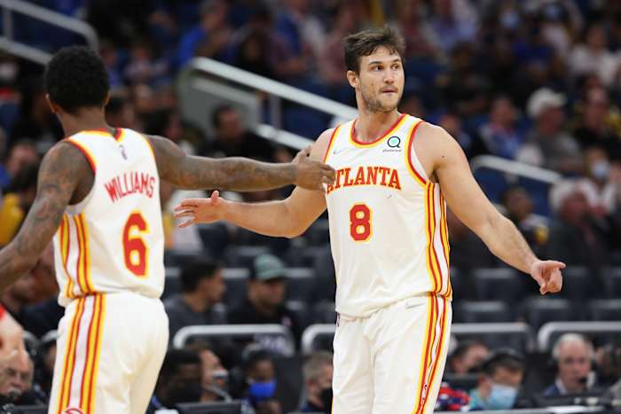 Dec 15, 2021; Orlando, Florida, USA; Atlanta Hawks forward Danilo Gallinari (8) celebrates with Atlanta Hawks guard Lou Williams (6) as he makes a three point basket against the Orlando Magic during the second half at Amway Center.