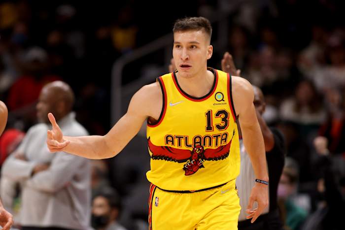 Jan 12, 2022; Atlanta, Georgia, USA; Atlanta Hawks guard Bogdan Bogdanovic (13) reacts after making a basket during the first quarter against the Miami Heat at State Farm Arena