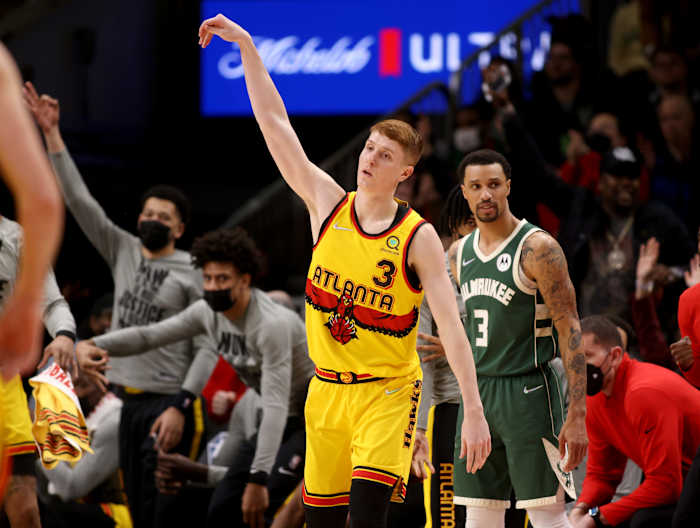 Jan 17, 2022; Atlanta, Georgia, USA; Atlanta Hawks guard Kevin Huerter (3) celebrates a three-point basket during the fourth quarter against the Milwaukee Bucks at State Farm Arena.