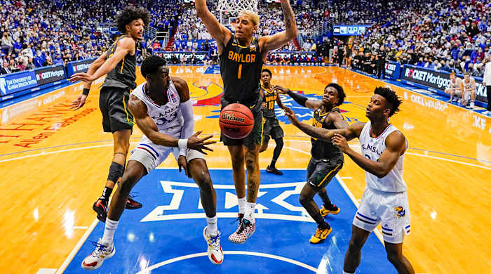 Kansas Jayhawks guard Jalen Coleman-Lands (55) passes to forward K.J. Adams (24) during the second half against the Baylor Bears at Allen Fieldhouse.