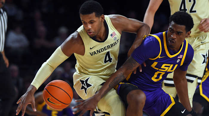 Vanderbilt Commodores forward Jordan Wright (4) handles the ball against LSU Tigers guard Brandon Murray (0) during the first half at Memorial Gymnasium.