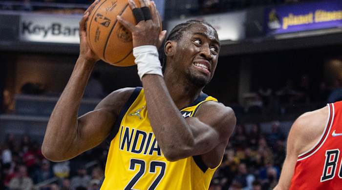 Indiana Pacers guard Caris LeVert (22) shoots the ball while Chicago Bulls center Nikola Vucevic (9) defends in the first half at Gainbridge Fieldhouse.