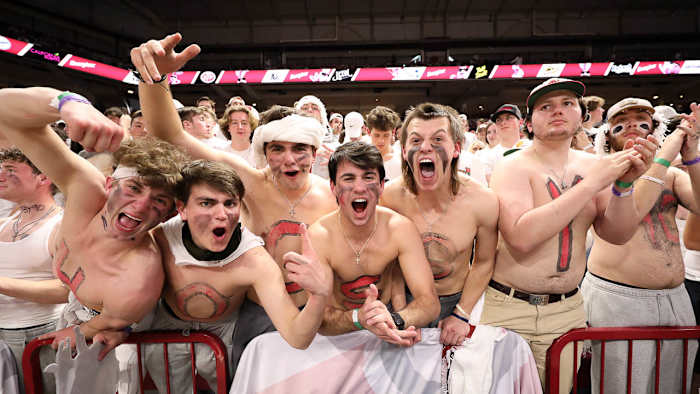 Arkansas fans lose their minds at a white-out game upset of No. 1 Auburn at Bud Walton Arena.