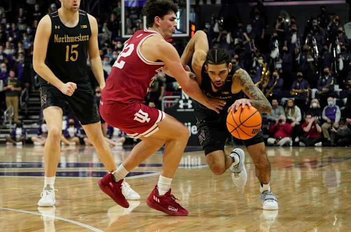 Feb 8, 2022; Evanston, Illinois, USA; Indiana Hoosiers guard Trey Galloway (32) defends Northwestern Wildcats guard Boo Buie (0) during the second half at Welsh-Ryan Arena.