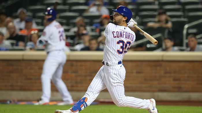 Sep 14, 2021; New York City, New York, USA; New York Mets right fielder Michael Conforto (30) follows through on an RBI single against the St. Louis Cardinals during the first inning at Citi Field. Mandatory Credit: Brad Penner-USA TODAY Sports