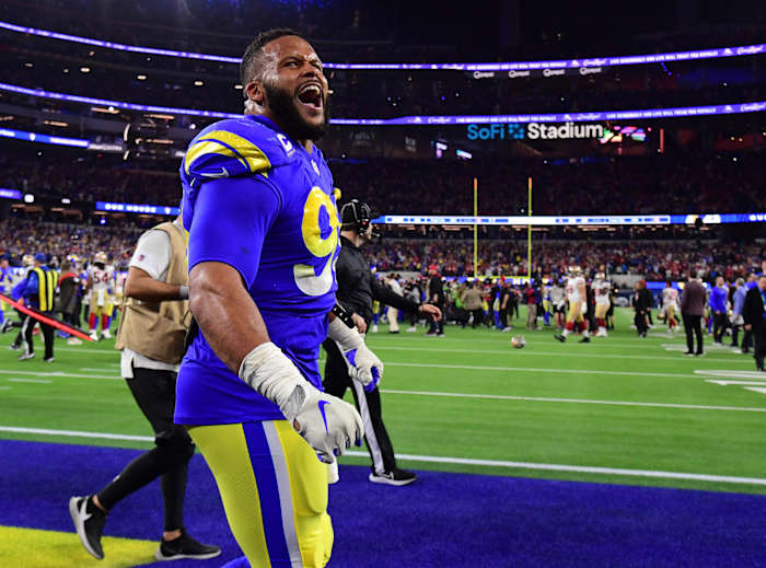 Jan 30, 2022; Inglewood, California, USA; Los Angeles Rams defensive end Aaron Donald (99) celebrates in the fourth quarter during the NFC Championship Game against the San Francisco 49ers at SoFi Stadium. Mandatory Credit: Gary A. Vasquez-USA TODAY Sports