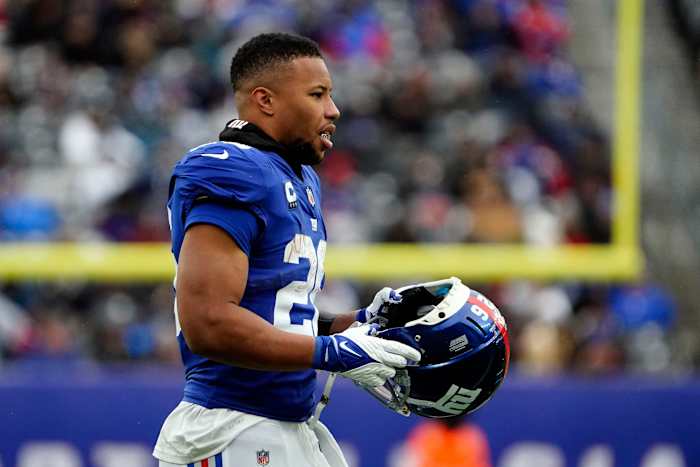 New York Giants running back Saquon Barkley (26) walks onto the field in the second half. The Giants lose to Washington, 22-7, at MetLife Stadium on Sunday, Jan. 9, 2022.