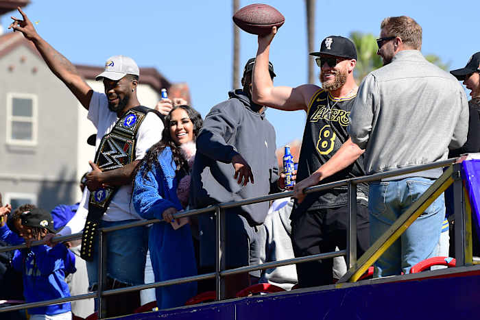 Feb 16, 2022; Los Angeles, CA, USA; Los Angeles Rams wide receiver Cooper Kupp and outside linebacker Leonard Floyd celebrate during the Los Angeles Rams Championship Parade. Mandatory Credit: Gary A. Vasquez-USA TODAY Sports