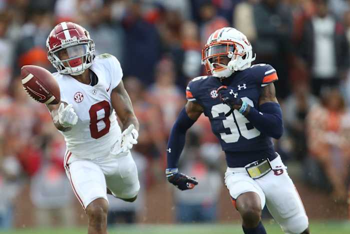 Nov 27, 2021; Auburn, Alabama, USA; Alabama Crimson Tide wide receiver John Metchie III (8) cannot catch a pass against Auburn Tigers Tigers defensive back Jaylin Simpson (36) during the first half at Jordan-Hare Stadium. Mandatory Credit: Gary Cosby Jr.-USA TODAY Sports