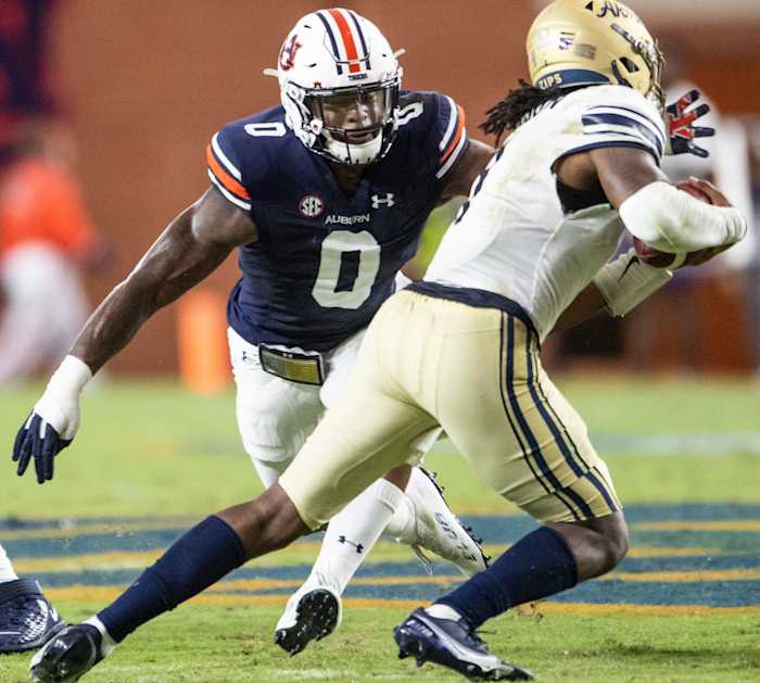Auburn Tigers linebacker Owen Pappoe (0) pressures the quarterback at Jordan-Hare Stadium in Auburn, Ala., on Saturday, Sept. 4, 2021. Auburn Tigers leads Akron Zips 37-0.