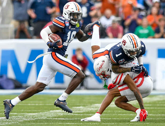 Auburn Tigers defensive back Nehemiah Pritchett (18) returns an interception against Houston during the Birmingham Bowl at Protective Stadium in Birmingham, Ala., on Tuesday December 28, 2021. Bham35