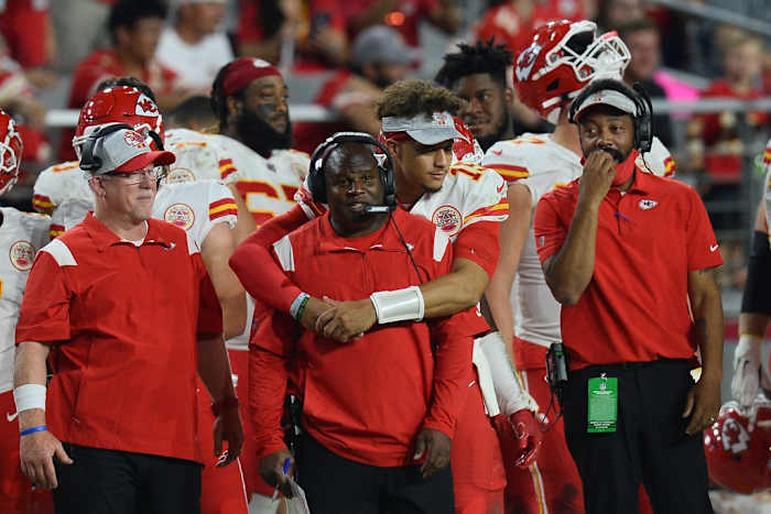 Aug 20, 2021; Glendale, Arizona, USA; Kansas City Chiefs quarterback Patrick Mahomes (15) hugs offensive coordinator Eric Bieniemy during the second half of the game against the Arizona Cardinals at State Farm Stadium. Mandatory Credit: Joe Camporeale-USA TODAY Sports