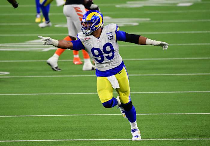 Feb 13, 2022; Inglewood, California, USA; Los Angeles Rams defensive tackle Aaron Donald (99) celebrates after a pressure in the fourth quarter against the Cincinnati Bengals in Super Bowl LVI at SoFi Stadium. Mandatory Credit: Gary A. Vasquez-USA TODAY Sports