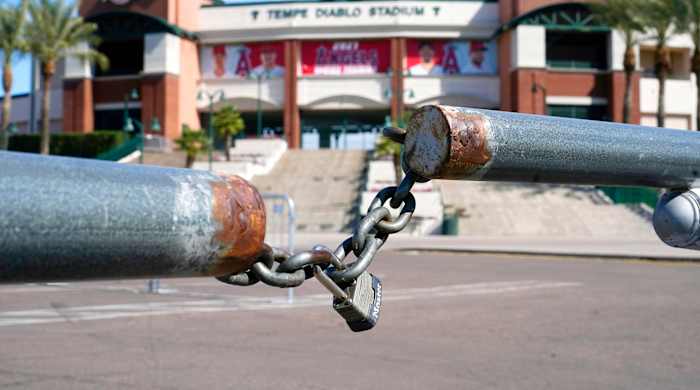 The main parking lot at the Los Angeles Angels Tempe Diablo Stadium remains closed as pitchers and catchers are not starting spring training workouts as scheduled as the Major League Baseball lockout enters its 77th day and will prevent pitchers and catchers from taking the field for the first time since October in Tempe, Ariz., Wednesday, Feb. 16, 2022.
