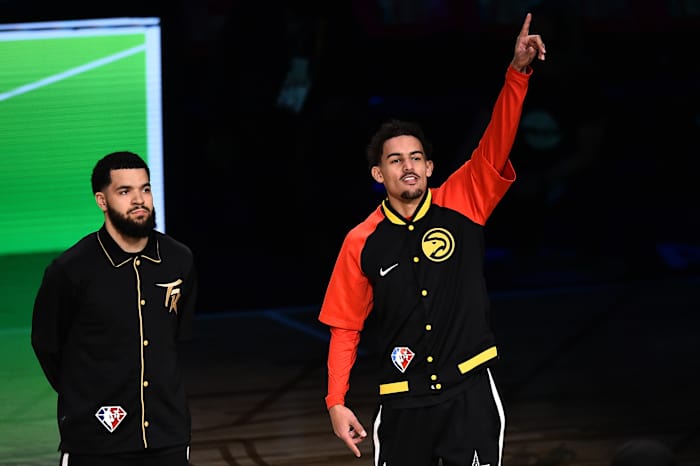 Trae Young points to the sky before the three-point contest.
