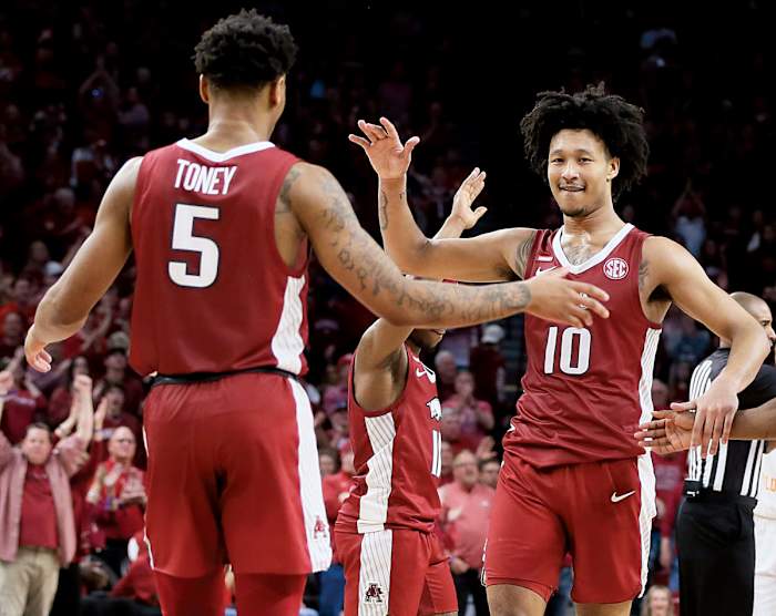 Arkansas Razorbacks forward Jaylin Williams (10) celebrates with guard Au'Diese Toney (5) during the second half against the Tennessee Volunteers at Bud Walton Arena. Arkansas won 58-48.