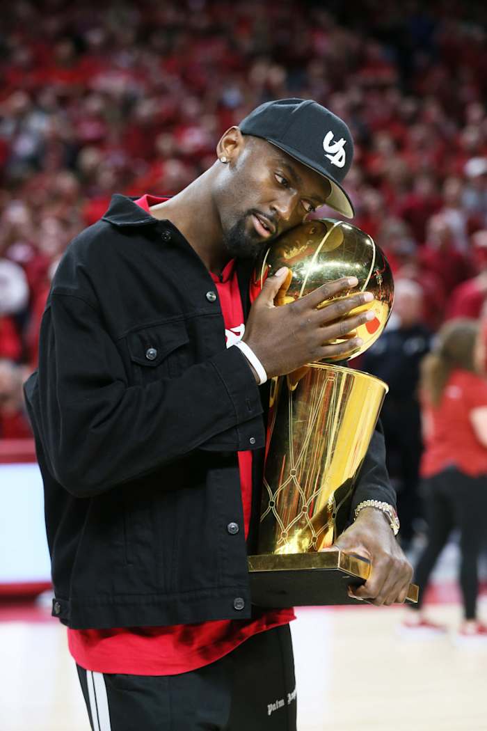 Former Arkansas Razorback Bobby Portis hugs the NBA championship he won last summer with the Milwaukee Bucks.