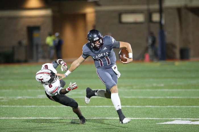 Benedictine quarterback Holden Geriner stiff-arms North Oconee's Rodrick Finch to the ground in a state semifinal win on Dec. 3 at Memorial Stadium.
