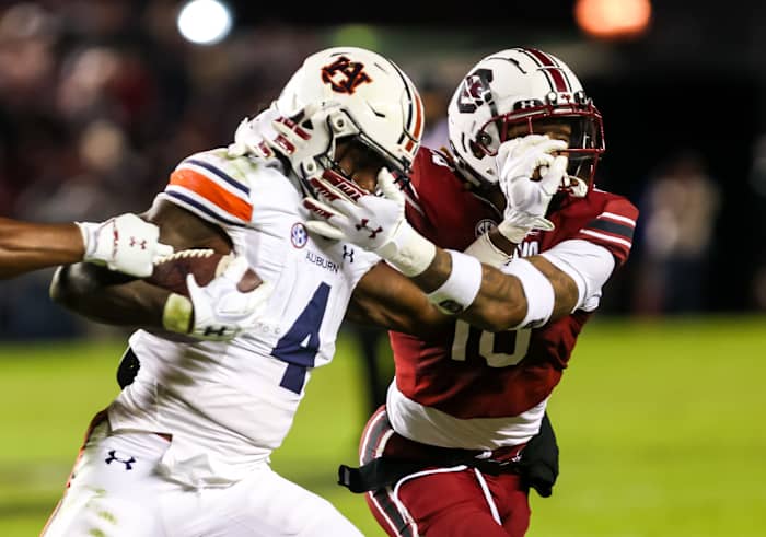 Nov 20, 2021; Columbia, South Carolina, USA; Auburn Tigers running back Tank Bigsby (4) is brought down by South Carolina Gamecocks defensive back R.J. Roderick (10) in the third quarter at Williams-Brice Stadium. Mandatory Credit: Jeff Blake-USA TODAY Sports