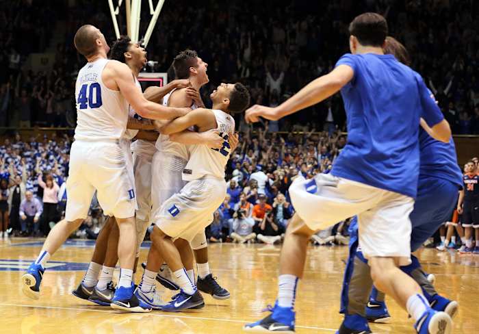 Duke celebrates Grayson Allen's buzzer-beating shot to give the Duke Blue Devils the win over the Virginia Cavaliers.