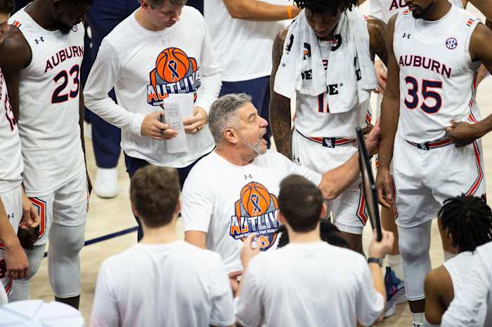 Auburn Tigers head coach Bruce Pearl talks with his team during a timeout as Auburn Tigers men's basketball takes on Texas A&M Aggies at Auburn Arena in Auburn, Ala., on Saturday, Feb. 12, 2022. Auburn Tigers defeated Texas A&M Aggies 75-58.