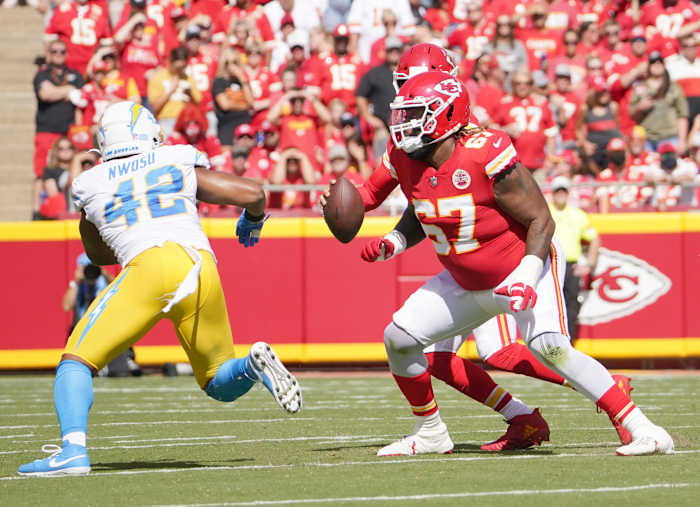 Sep 26, 2021; Kansas City, Missouri, USA; Kansas City Chiefs offensive tackle Lucas Niang (67) prepares to block Los Angeles Chargers linebacker Uchenna Nwosu (42) during the game at GEHA Field at Arrowhead Stadium. Mandatory Credit: Denny Medley-USA TODAY Sports