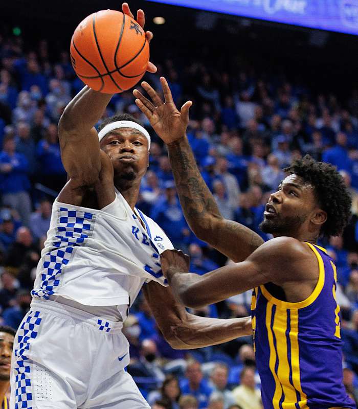 Kentucky Wildcats forward Oscar Tshiebwe (34) reaches for a rebound against LSU Tigers forward Tari Eason (13) during the second half at Rupp Arena at Central Bank Center.