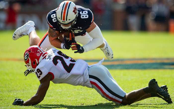 Auburn Tigers tight end Luke Deal (86) fights for yards against Georgia Bulldogs defensive back Christopher Smith (29) at Jordan-Hare Stadium in Auburn, Ala., on Saturday, Oct. 9, 2021. Auga01